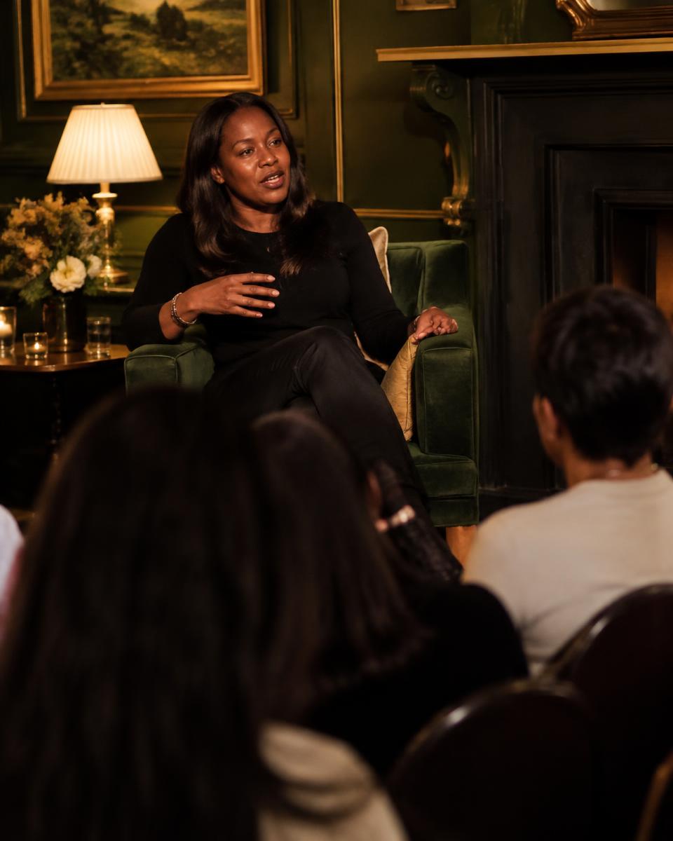 A speaker leading a fireside chat